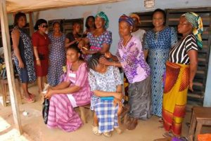 Women gathered in a room, some seated and some standing, at a stallholders session