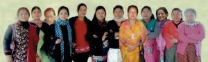 A long row of women standing side by side indoors